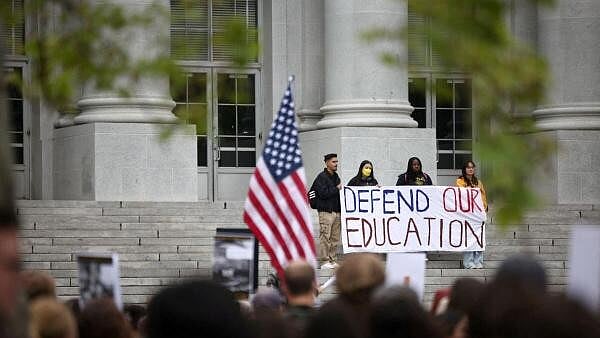 <div class="paragraphs"><p>Demonstrators hold a banner during a 'Stand Up for Internationals' rally on the campus of Berkeley University in Berkeley, California.</p></div>