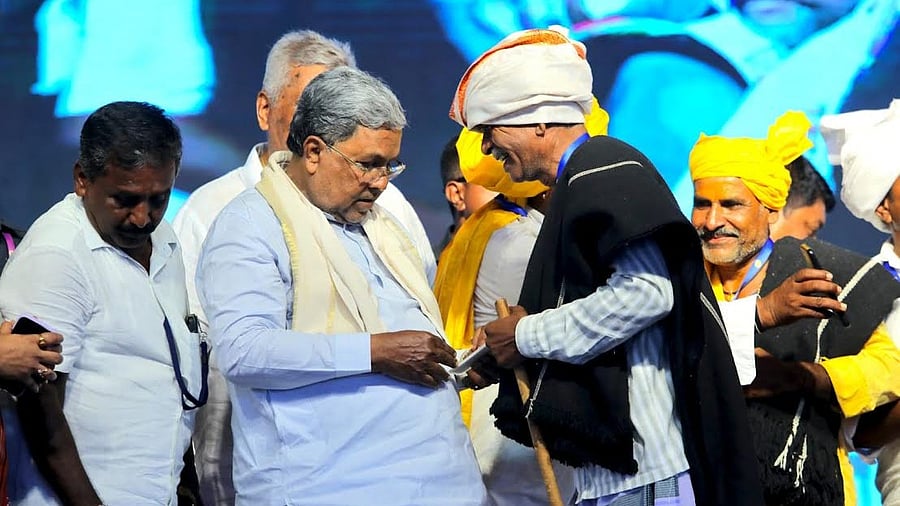 <div class="paragraphs"><p>Chief Minister Siddaramaiah distributes ID cards to Shepherds at the foundation laying ceremony of various developmental works in Periyapatna, Mysuru district on Sat</p></div>