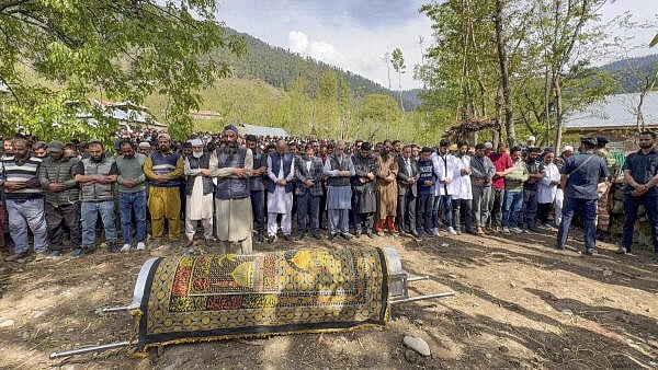 <div class="paragraphs"><p>J&amp;K Chief Minister Omar Abdullah and others pay their last respects to the mortal remains of Adil Hussain Shah, a pony ride operator who was killed in a terrorist attack in Pahalgam on Tuesday, in Anantnag district, Jammu &amp; Kashmir.</p></div>