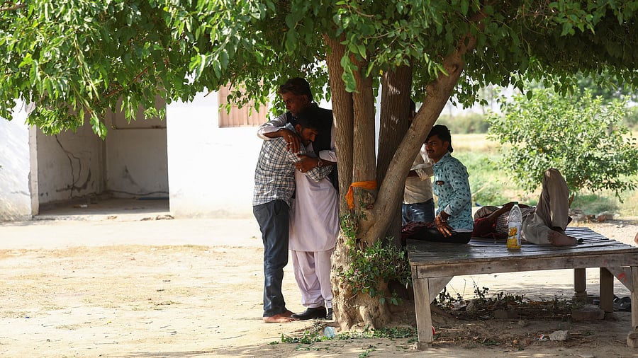 <div class="paragraphs"><p>A man hugs his relative after entering India through the Attari-Wagah border on Saturday, following Pakistan’s revocation of all visas issued to Indian citizens. </p></div>