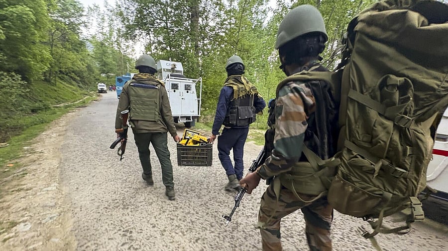 <div class="paragraphs"><p>Security forces personnel during a search operation</p></div>