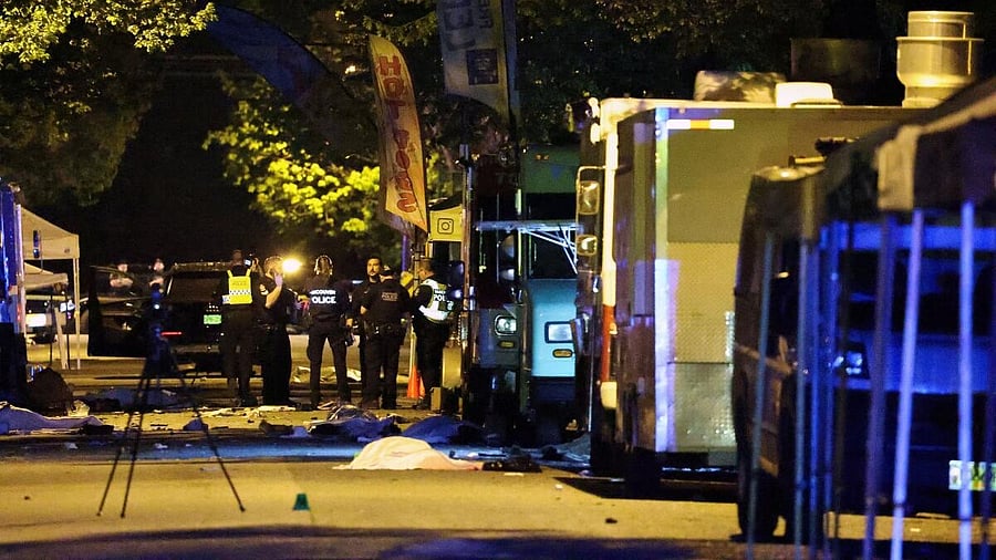 <div class="paragraphs"><p>Police officers work at the scene, as bodies of victims lie covered on the ground, after a vehicle drove into a crowd at the Lapu Lapu day block party, in which police say multiple people were killed and injured, in Vancouver, Canada April 27, 2025.</p></div>