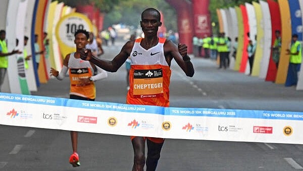 <div class="paragraphs"><p>International Elite Athlete (men) long-distance Ugandan runner Joshua Cheptegei crosses the finish line to win at the TCS World 10K run in Bengaluru on Sunday. </p></div>