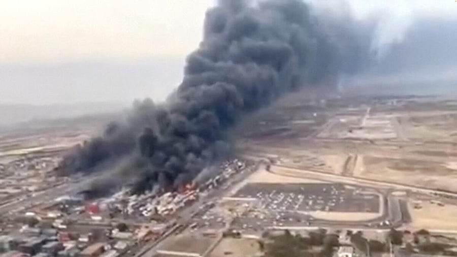 <div class="paragraphs"><p>An aerial view shows plumes of thick black smoke rising, following a suspected explosion of chemical materials</p></div>