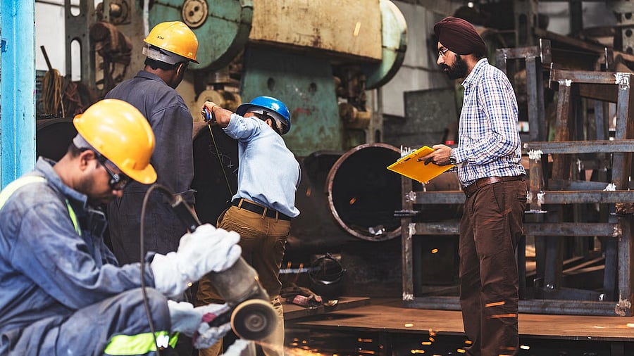 <div class="paragraphs"><p>Image showing workers at a factory. </p></div>