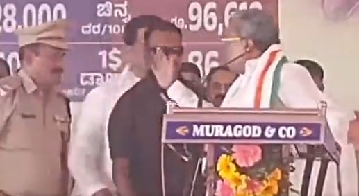 <div class="paragraphs"><p>Siddaramaiah raises his hand in anger against&nbsp; Dharwad ASP Narayan Baramani.&nbsp;</p></div>