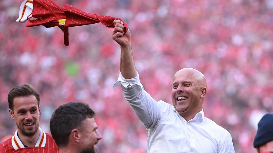 <div class="paragraphs"><p>Liverpool manager Arne Slot celebrates after winning the Premier League. </p></div>