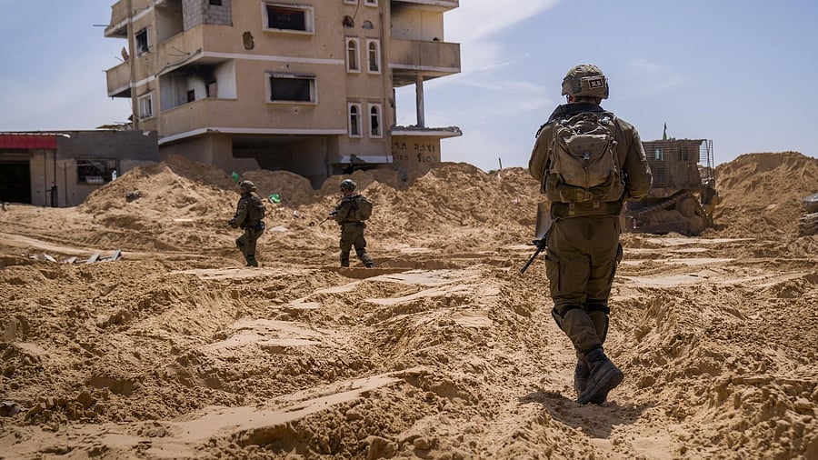 <div class="paragraphs"><p>A picture released by the Israeli Army says to show Israeli soldiers conducting operations in a location given as Tel Al-Sultan area, Rafah Governorate, Gaza</p></div>