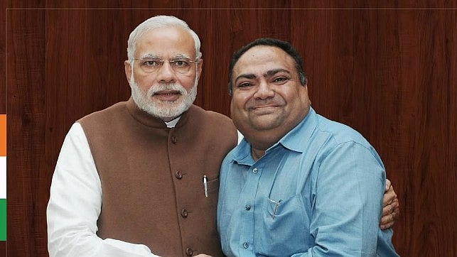<div class="paragraphs"><p>Lavji Daliya (R) with Narendra Modi.&nbsp;</p></div>