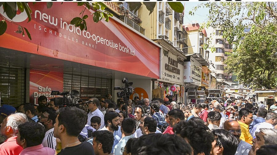 <div class="paragraphs"><p>Customers gather at New India Co-operative Bank, in Mumbai.</p></div>