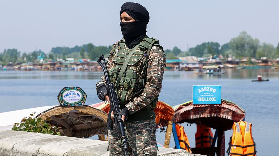 <div class="paragraphs"><p>Indian security force personnel stands guard on the banks of Dal Lake, following a suspected militant attack near south Kashmir's Pahalgam, in Srinagar April 27, 2025.</p></div>