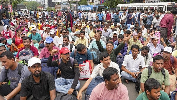 <div class="paragraphs"><p>United Teaching and Non-Teaching Forum members, who lost their job following a court verdict, sit on the road in protest in Kolkata.&nbsp;</p></div>