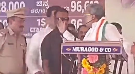<div class="paragraphs"><p>Siddaramaiah raises his hand in anger against Dharwad ASP Narayan Baramani. </p></div>