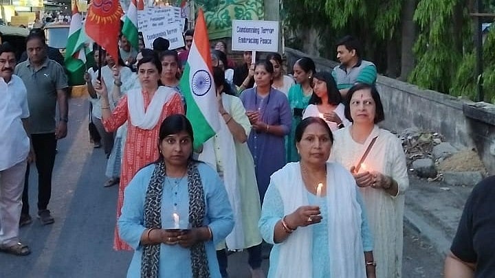 <div class="paragraphs"><p>Women at the candlelight march organised by Beautiful Begur on Sunday.&nbsp; </p></div>