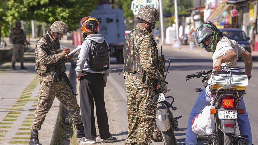 <div class="paragraphs"><p>Security personnel check identity cards of commuters, in the aftermath of the Pahalgam terror attack, in Srinagar. </p></div>