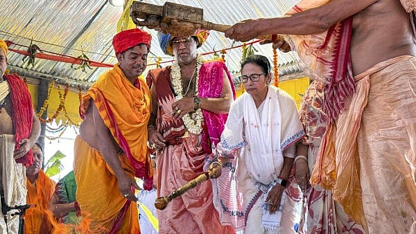 <div class="paragraphs"><p>West Bengal Chief Minister Mamata Banerjee takes part in the sacred 'yajna' at the Lord Jagannath temple, at Digha, in Purba Medinipur district, West Bengal.</p></div>