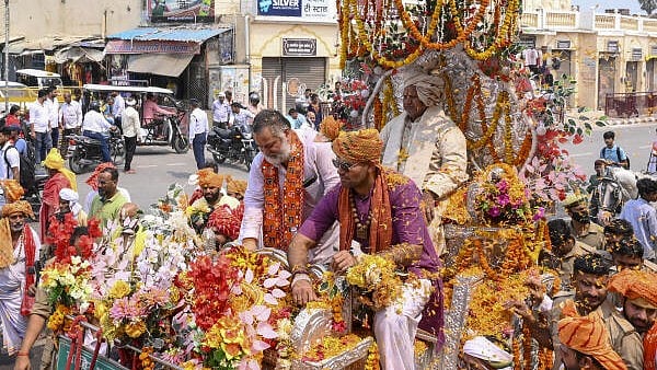 <div class="paragraphs"><p>Mahant Prem Das, the chief priest of Ayodhya’s Hanuman Garhi temple, takes part in a procession to visit Ram Mandir, in Ayodhya on Wednesday. </p></div>