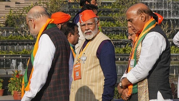 <div class="paragraphs"><p>PM Modi seen with Rajnath Singh (R) and Amit Shah (L). </p></div>