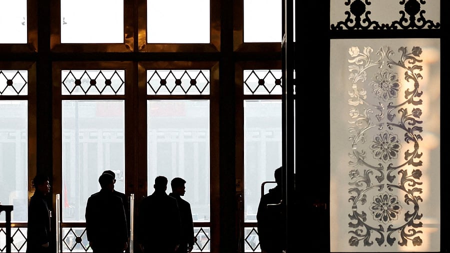 <div class="paragraphs"><p>Security personnel keep watch at the second plenary session of the National People's Congress , at the Great Hall of the People in Beijing, China</p></div>
