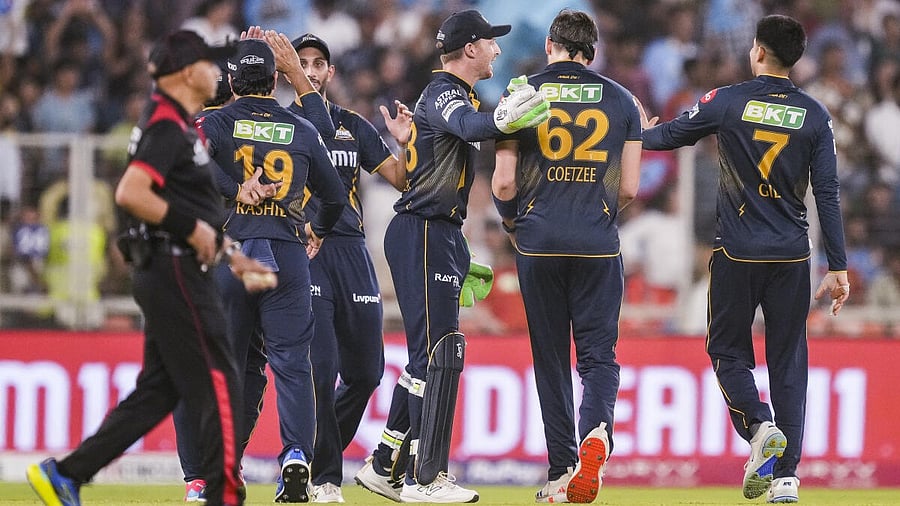 <div class="paragraphs"><p>Gujarat Titans' Gerald Coetzee with teammates celebrates the wicket of Sunrisers Hyderabad's Ishan Kishan during the Indian Premier League (IPL) 2025 cricket match between Gujarat Titans and Sunrisers Hyderabad, in Ahmedabad, Friday, May 2, 2025.</p></div>