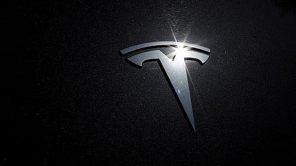 <div class="paragraphs"><p>The Tesla logo. </p></div>
