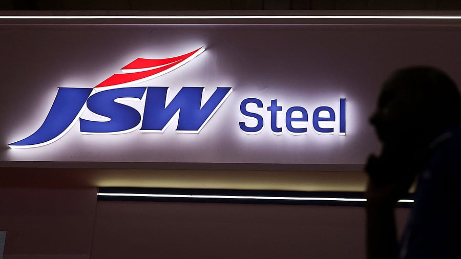 <div class="paragraphs"><p>A man walks past the JSW Steel stall at the India Steel 2025 Conference in Mumbai, India, April 25, 2025.</p></div>