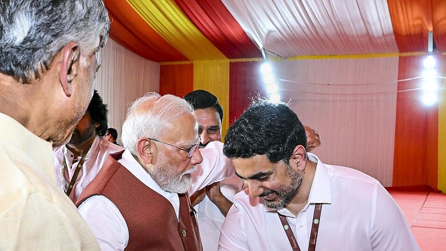<div class="paragraphs"><p>Prime Minister Narendra Modi being welcomed at a public meeting by Andhra Pradesh Chief Minister N Chandrababu Naidu and Minister Nara Lokesh.</p></div>