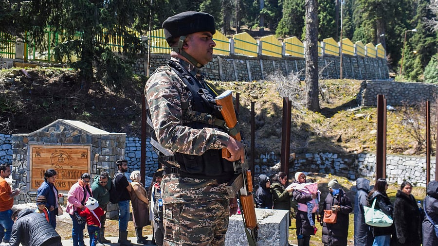 <div class="paragraphs"><p>A security guard posted at a cable car station, as tourists line up, at Gulmarg in Jammu &amp; Kashmir, in the aftermath of the Pahalgam terror attack.</p></div>