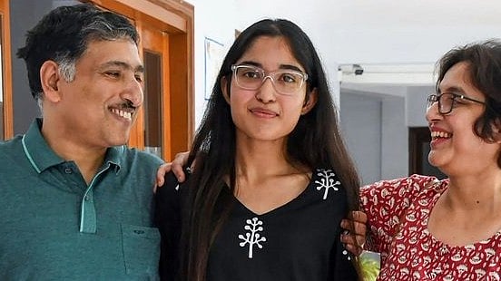 <div class="paragraphs"><p>Srijani with&nbsp;her parents.&nbsp;</p></div>