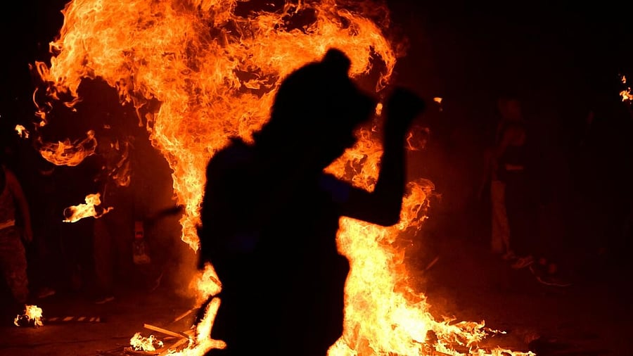 <div class="paragraphs"><p>A reveler is silhouetted against a bonfire during the Tuzamapan Carnival, as part of the traditional "burning of bad humor", in Tuzamapan, Veracruz state, Mexico May 1, 2025.</p></div>