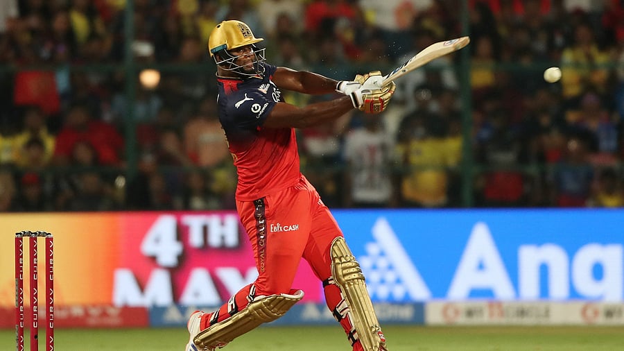 <div class="paragraphs"><p>Royal Challengers Bengaluru's Romario Shepherd in action as he hits four runs.</p></div>