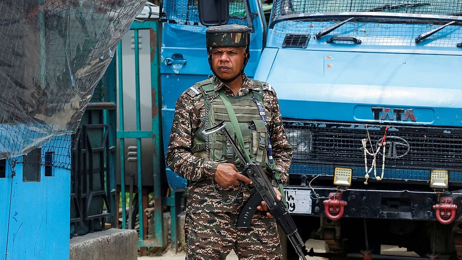 <div class="paragraphs"><p>A security force personnel stands guard on a street.</p></div>