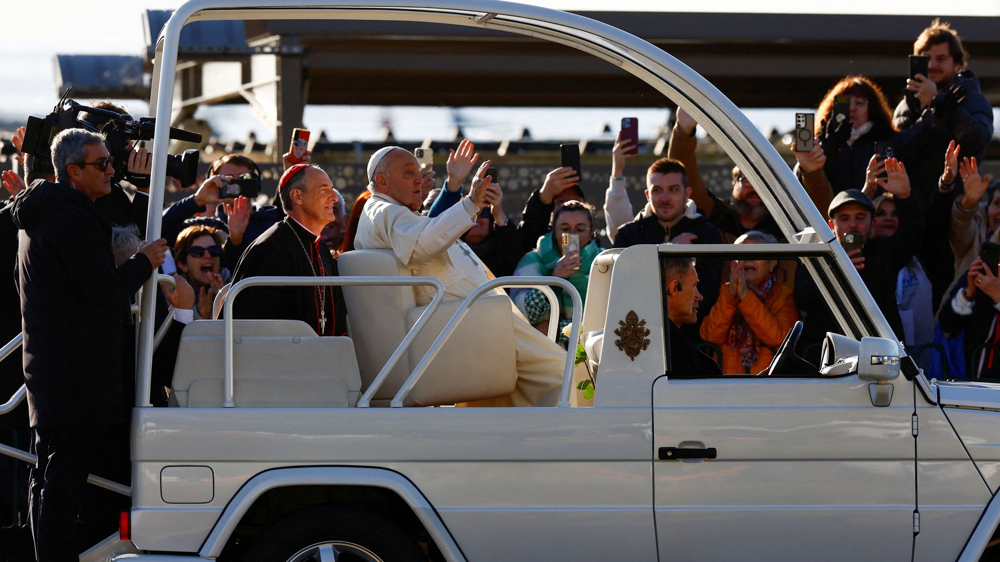 <div class="paragraphs"><p>File Photo: People welcome Pope Francis for his visit in his popemobile </p></div>