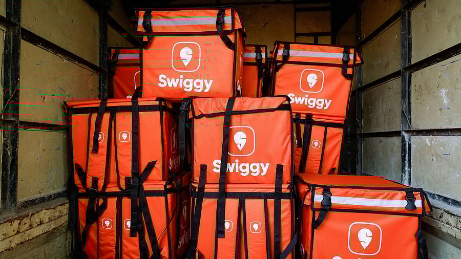 <div class="paragraphs"><p>FILE PHOTO: Swiggy delivery bags are stored inside a truck Mumbai, India.</p></div>