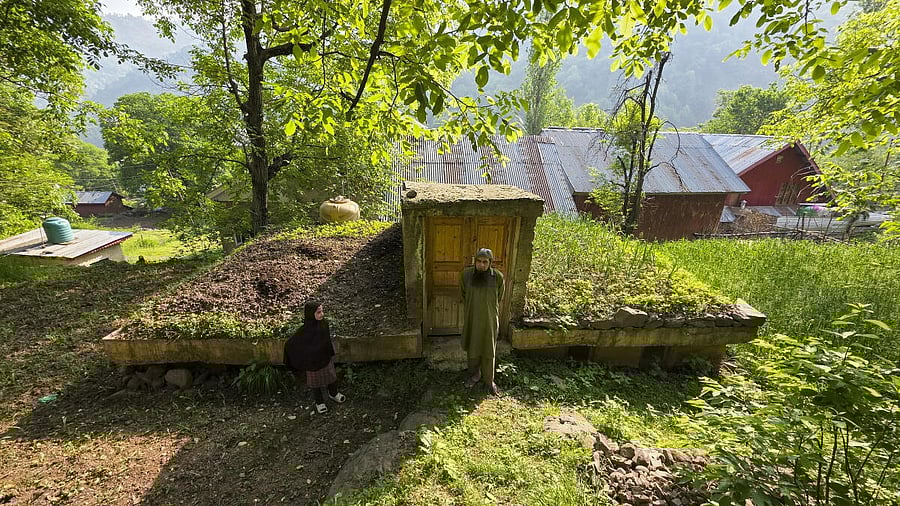 <div class="paragraphs"><p>People stand near an underground bunker, near the Line of Control at Uri sector in Baramulla district of J&amp;K, Thursday, May 1, 2025. Residents in the remote border villages are preparing the underground bunkers in the wake of rising tensions between India and Pakistan, following the Pahalgam terror attack.</p></div>