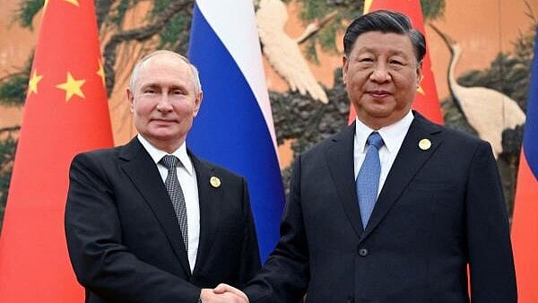 <div class="paragraphs"><p>File photo of Chinese President Xi Jinping (R) with his Russian counterpart Vladimir Putin (L).</p></div>