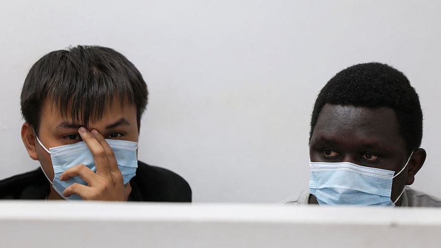 <div class="paragraphs"><p>Vietnamese national Duh Hung Nyugen and Kenyan Dennis Ng'ang'a react during their sentencing after they pleaded guilty of illegal possession and trafficking of garden ants, they were both fined U.S. dollars 7,700 or one year imprisonment, at the Jomo Kenyatta International Airport Law Courts, in Nairobi, Kenya May 7, 2025. </p></div>