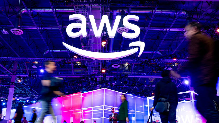 <div class="paragraphs"><p>FILE PHOTO: Attendees walk through an expo hall at AWS re:Invent event,</p></div>