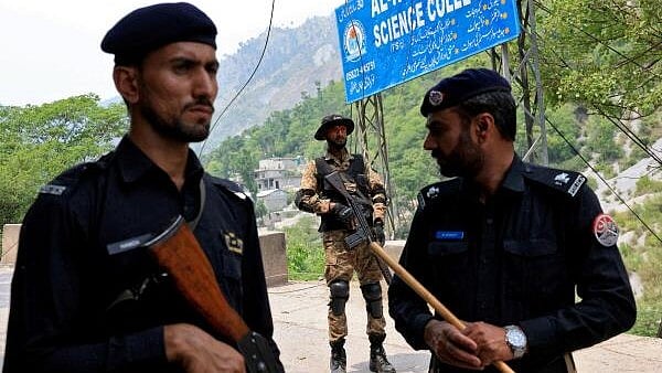 <div class="paragraphs"><p>Security force personnel stand guard on a road leading to Bilal Mosque after it was hit by an Indian strike in Muzaffarabad</p></div>