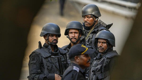 <div class="paragraphs"><p>Security personnel take part in a drill conducted as a part of the nationwide civil defence exercise, at the administrative office of the Chennai Port Trust, in Chennai on Wednesday.</p></div>