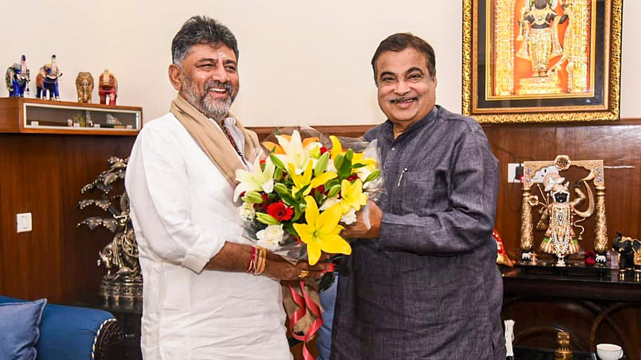 Deputy Chief Minister D K Shivakumar calls on Union Minister Nitin Gadkari during a meeting to review the progress of ongoing national highway projects in Karnataka, in New Delhi on Wednesday. PTI photo