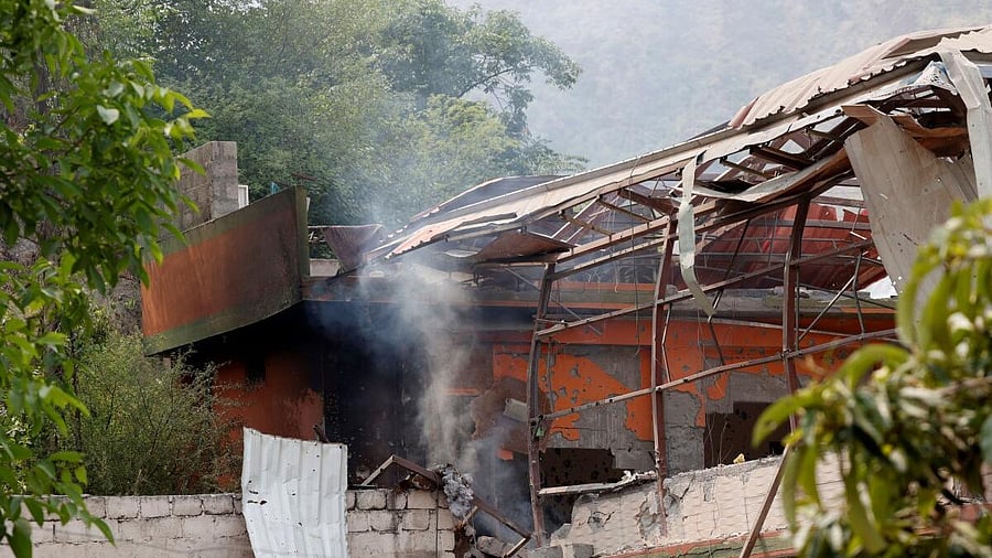 <div class="paragraphs"><p>Smoke rises from a house after it was hit by an Indian strike in Muzaffarabad in PoK.</p></div>