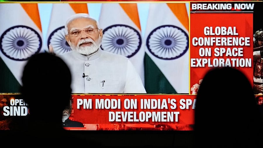<div class="paragraphs"><p>People watch a telecast of Prime Minister Narendra Modi's message for the Global Space Exploration Conference, in Mumbai, Wednesday, May 7, 2025.</p></div>