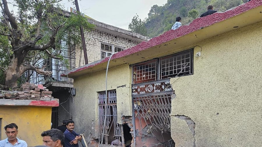 <div class="paragraphs"><p>Rajouri: People gather near a damaged property after alleged heavy firing and shelling by Pakistan military overnight across the Line of Control and International Border, at Irwan Khanetar village in Rajouri, Jammu and Kashmir, Wednesday, May 7, 2025. At least three civilians were killed and ten injured in the incident, according to officials.</p></div>