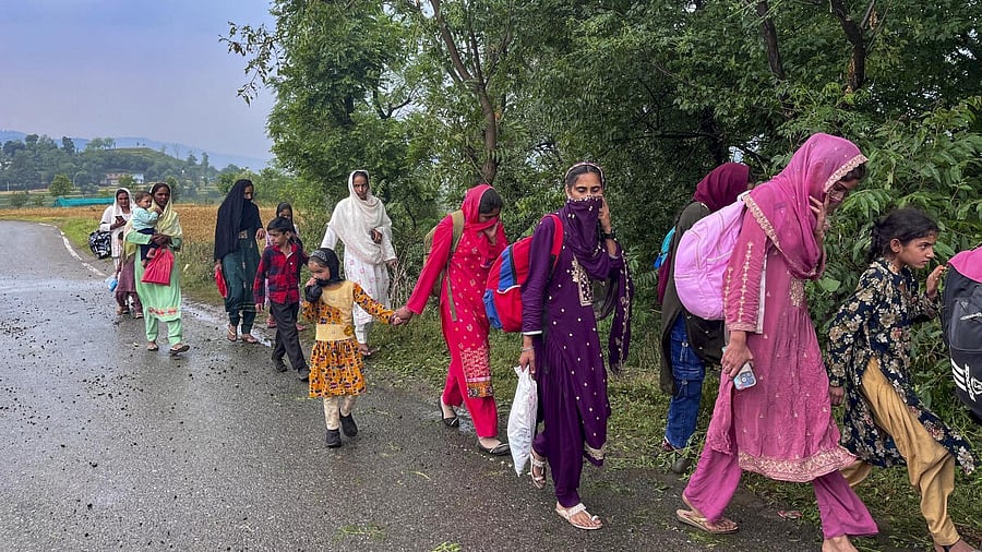 <div class="paragraphs"><p>People from border areas shift to safer place following shelling by Pakistani troops, at Mendhar in Poonch, Friday.&nbsp;</p></div>