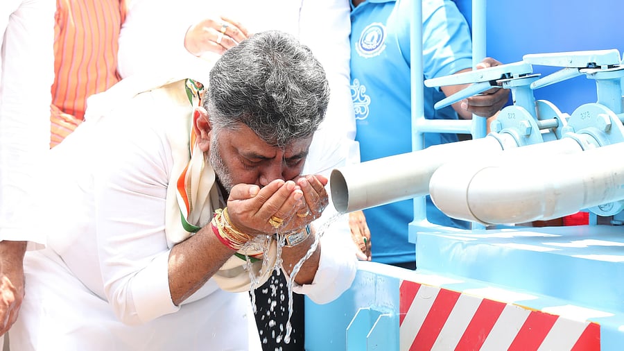 <div class="paragraphs"><p>Deputy Chief Minister DK Shivakumar drinks water during the launch of the mobile Cauvery water at Vidhana Soudha on Friday. </p></div>