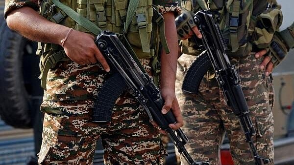 <div class="paragraphs"><p>Indian security force personnel stand guard </p></div>