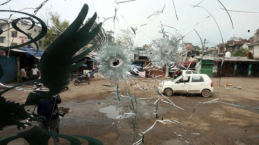 <div class="paragraphs"><p>People are seen through the windshield of a bus damaged by a cross-border shelling in Poonch near the Line of Control (LoC) between India and Pakistan, May 8, 2025.</p></div>