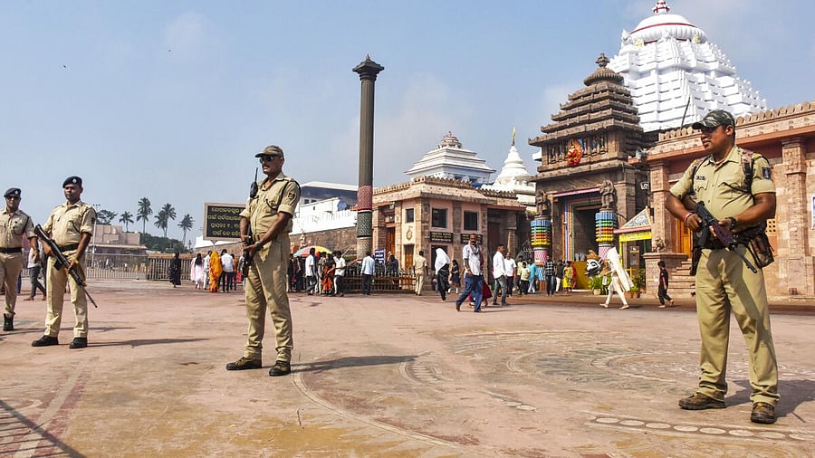 <div class="paragraphs"><p>Police personnel stand guard at the Jagannath Temple, amid tight security in the wake of the ongoing military conflict between India and Pakistan, in Puri, Odisha, Friday, May 9, 2025.</p></div>