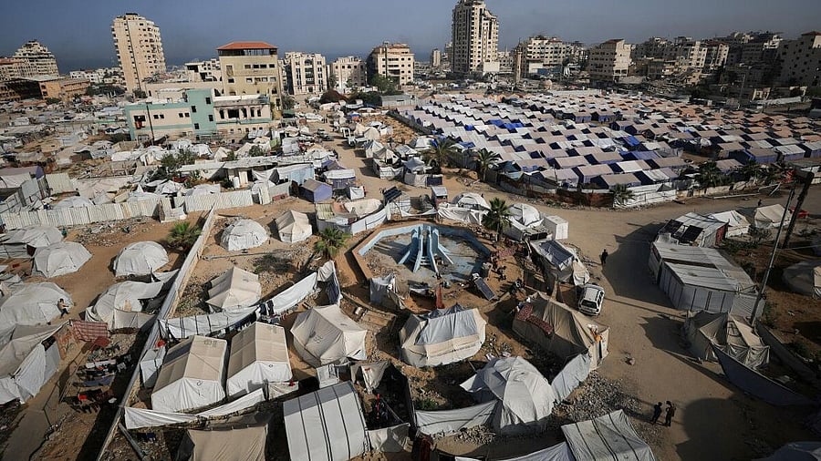 <div class="paragraphs"><p>Palestinians displaced by the Israeli military offensive, shelter in tents, in Gaza City May 11, 2025.</p></div>
